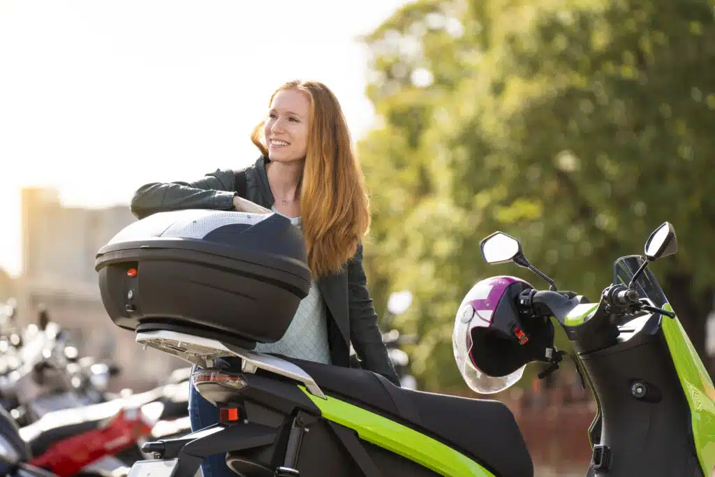 red haired woman on her motorcycle in a parking lo 2023 11 27 05 03 47 utc